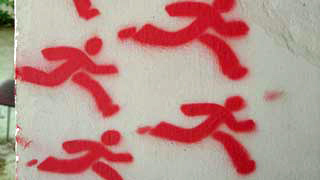 Zeichnungen laufender Mnnchen auf Wand