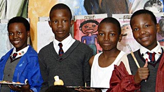 Children in front of the Masibambane College in South Africa