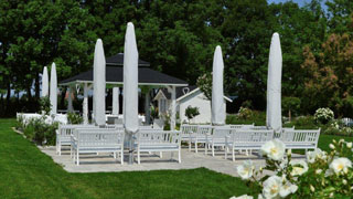White benches and parasols
