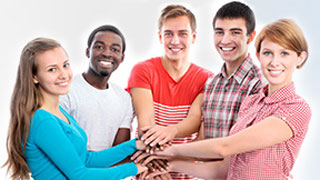 group of young people stacking their hands