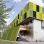 Visualisierung des künftigen Verwaltungsgebäudes der Klinik Ottakring: moderner Bau mit grünen Elementen und Fassadenbegrünung