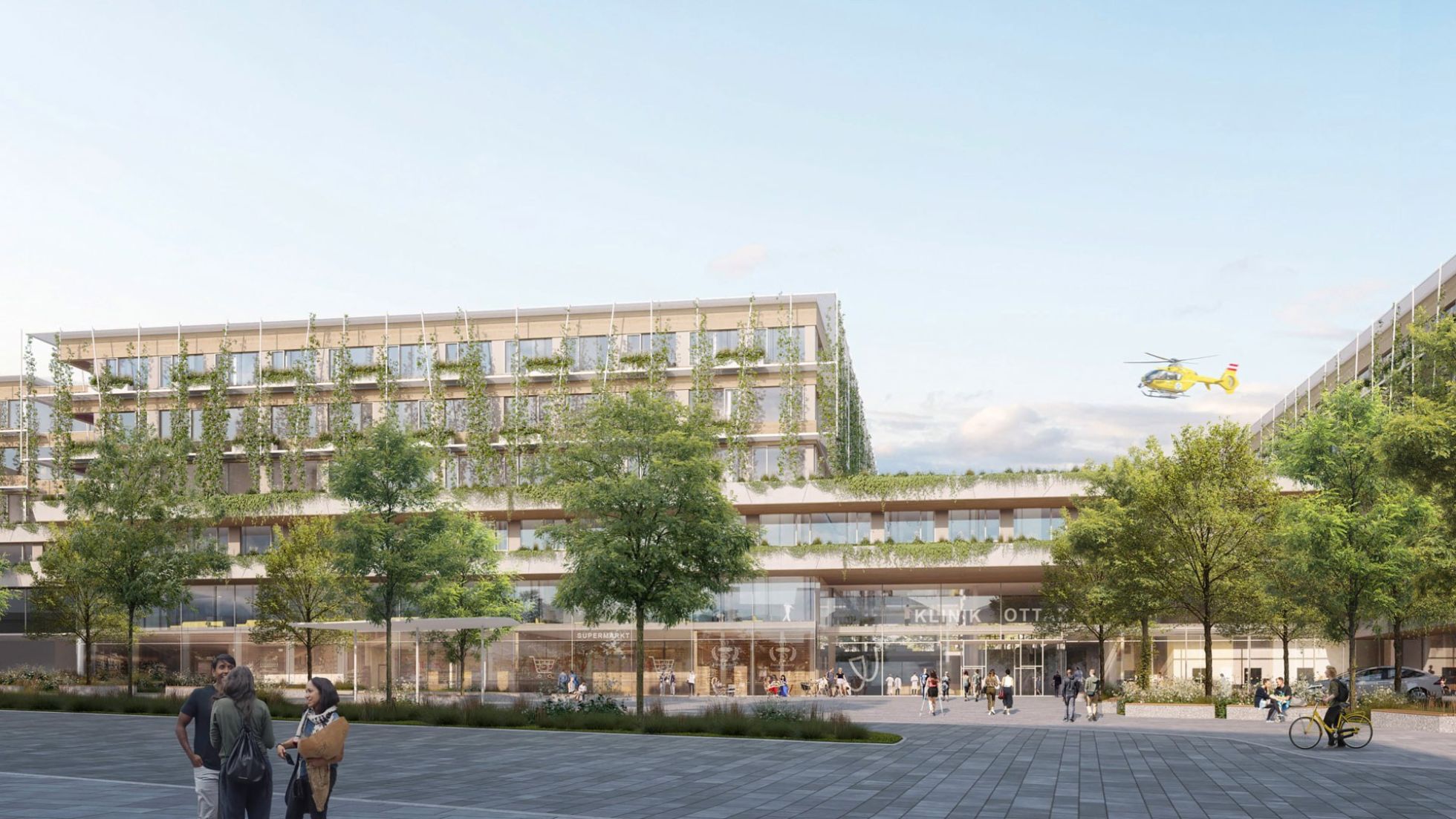 copyright: AHA - Austrian Healthcare Architects Visualisierung zeigt mehrere verbundene Klinikgebäude, davor Bäume und ein weitläufiger Platz