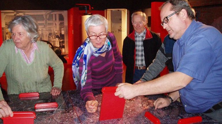 copyright: ÖTK-Klosterneuburg Man showing an exhibit to a woman.