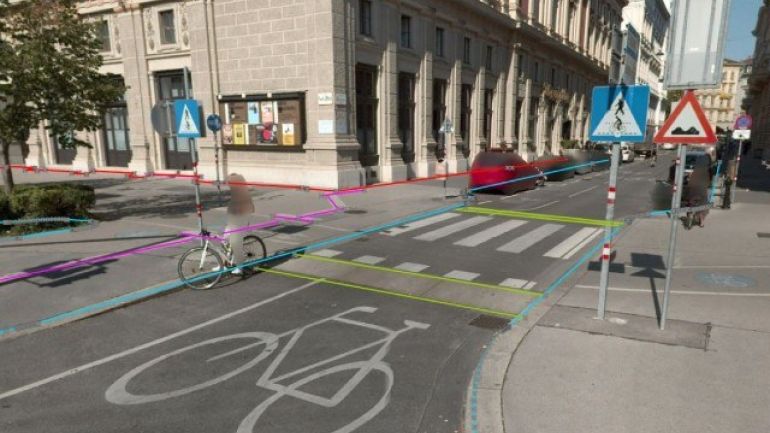 copyright: MA 41 Stadtvermessung Straße mit großem Rad-Symbol und Zebrastreifen, Häuser, Autos