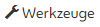 Schraubenschlüssel, daneben Schriftzug Werkzeuge