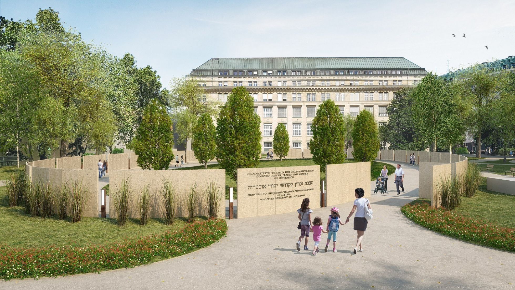 Denkmal in einem Park, dahinter ein Gebäude