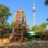 copyright: Philip Jandl Climbing frame with a slide in the shape of a rocket, with the Danube Tower behind it.