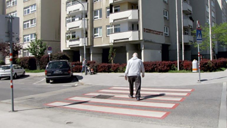 Kreuzungsbereich Dirmhirngasse - Amstergasse: Gehweg durch eine Grünanlage