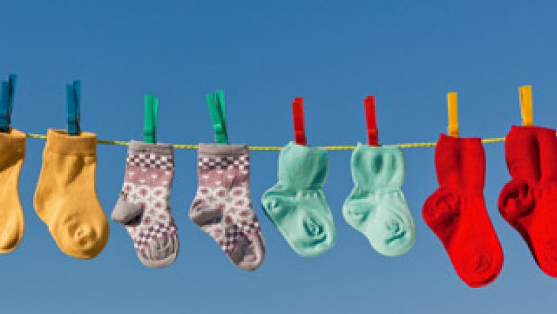 copyright: Erwin Wodicka Babysocken auf einer Wäscheleine