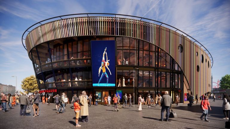 copyright: Haworth Tompkins Visualisierung des neuen Musical-Hauses zeigt modernes Gebäude mit rundlicher Optik und Glas-Holz-Fassade.