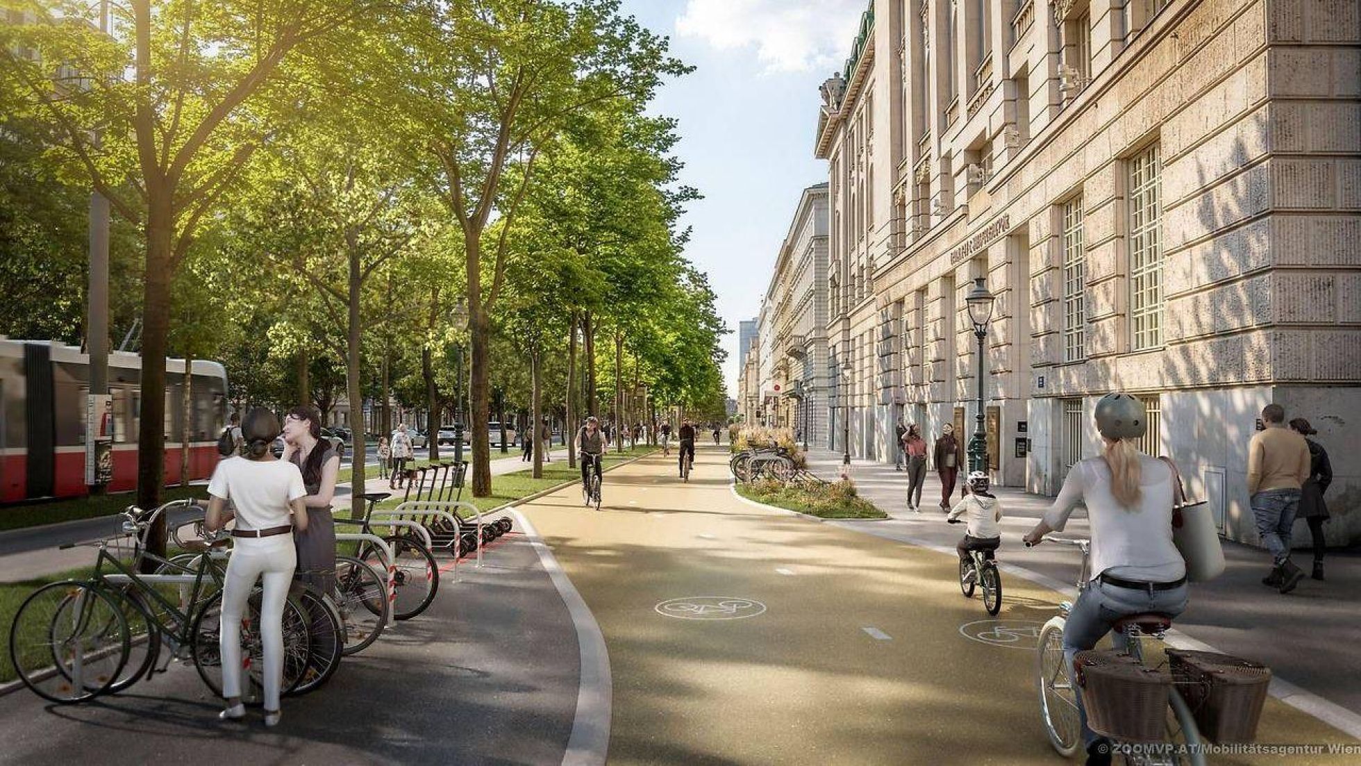 copyright: Mobilitätsagentur Wien / ZOOMVP.AT Breiter 2-Richtungsradweg neben der Universität Wien. Rechts vom Radweg ist ein Gehweg, links eine Baum-Allee mit einem weiteren Gehweg. Vor der Uni sind Fahrradabstellplätze.