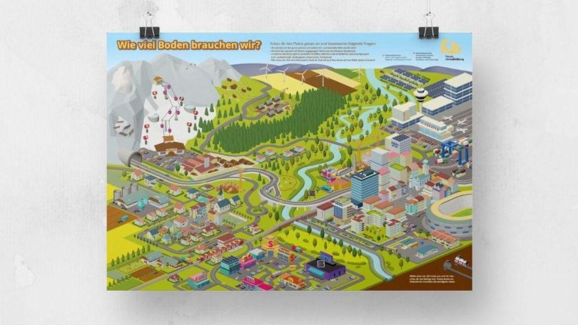 Buntes Plakat hängt vor einer weißen Wand