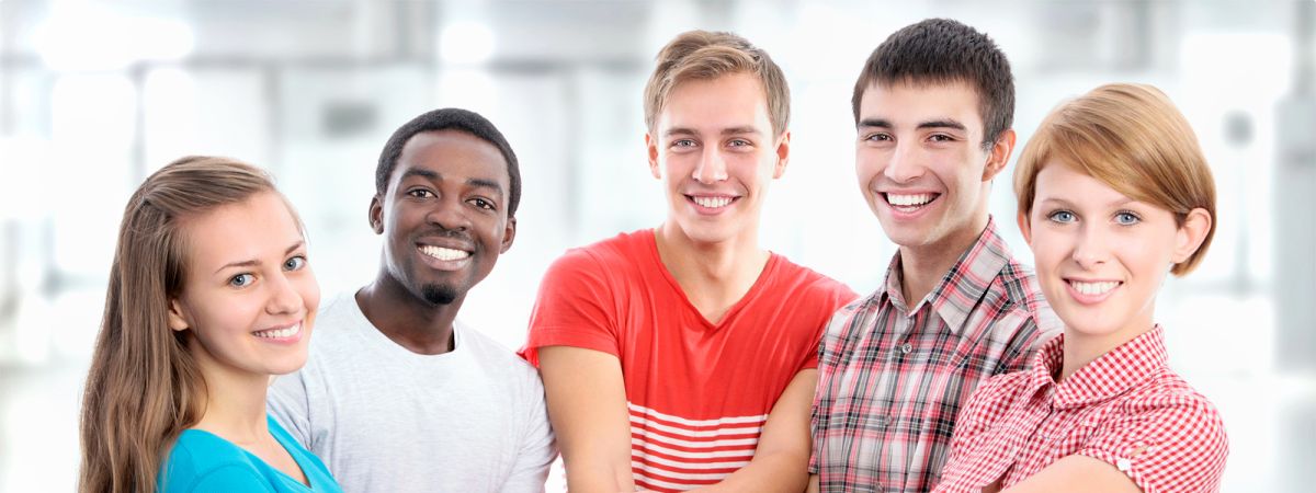 group of young people stacking their hands