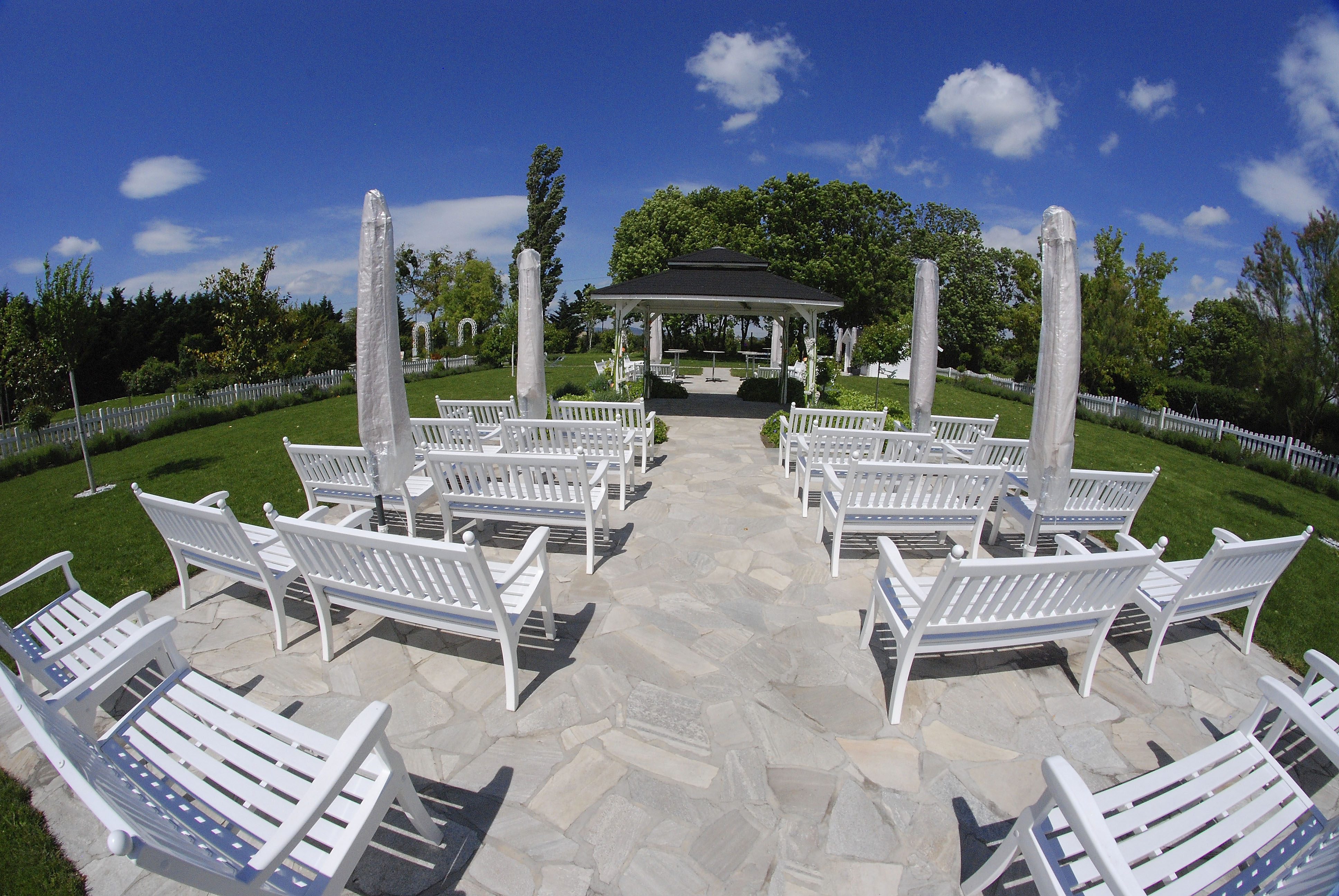 Pavilion, with white benches in front of it