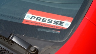 Press sign in the car