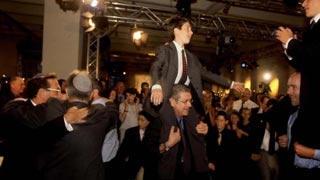 Jewish men and boys dancing at festival