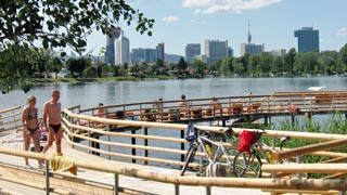 Jetty on the waterfront, skyline in the background