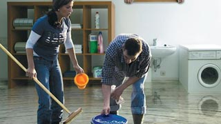 Woman and man in a flooded cellar