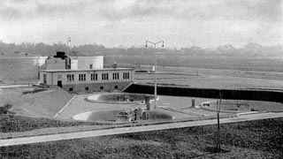 Black and white photograph of a wastewater treatment plant