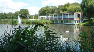 View over the lake to the Korean Cultural Centre in the Donau Park