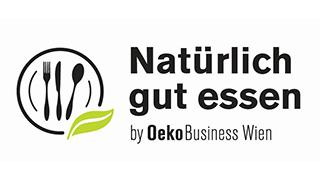 Logo "Natürlich gut essen" by OekoBusiness Wien, Teller, auf dem Besteck liegt, mit einem grünen Blatt am Tellerrand