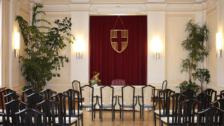 wedding hall with table and black chairs